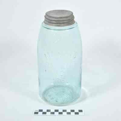 Large, light blue glass jar with lid