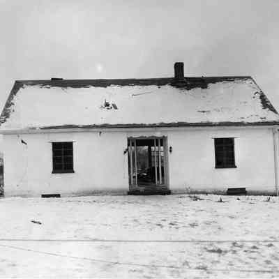 Halltown dynamite truck explosion - one story house with explosion damage, site of only fatality