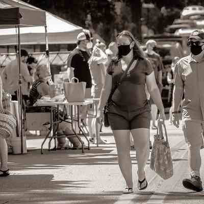 Individuals wearing masks at Charles Town Farmers Market; vendor stands (IMG3914005)
