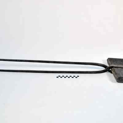 Heavy, long handled iron for making waffles in a fireplace