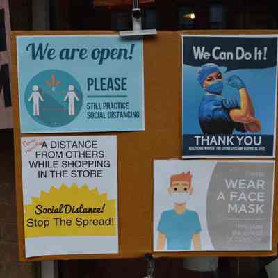 Pandemic signs at Dickinson & Wait Craft Gallery