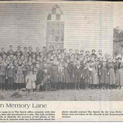 Individuals standing in front of unidentified church