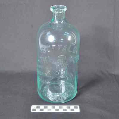 Clear blue-green glass water bottle