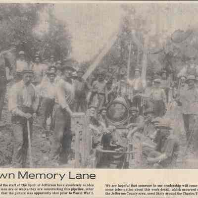 Individuals constructing pipelinie, location unknown