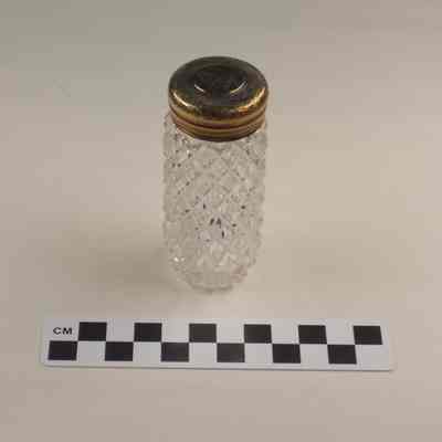 Cut glass bottle with gold washed cap