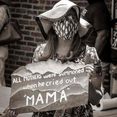 Woman wearing mask holding Black Lives Matter sign (IMG3915008)