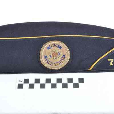 Dark blue garrison cap with gold braid