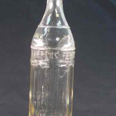 Clear glass beverage bottle