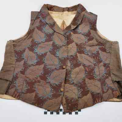 Dark brown lined vest with brocade leaf design