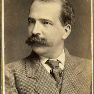 Young man with a mustache and tweed jacket