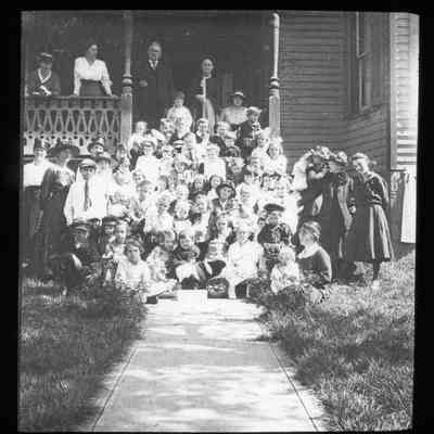 Children and adults on porch steps