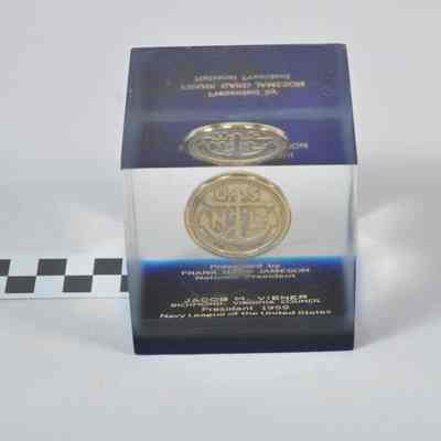 Souvenir coin embedded in clear lucite block