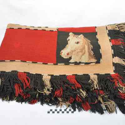 Heavy blanket of knitted wool for use in a carriage or buggy