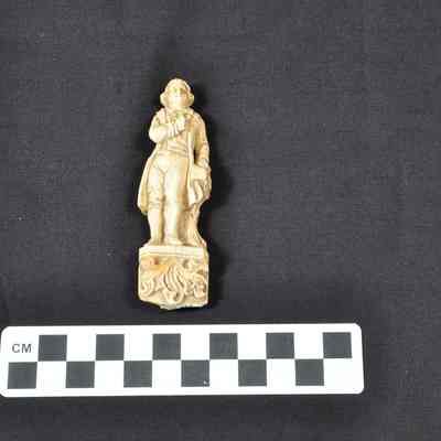 One carved ivory figurine depicting a young Thomas Jefferson