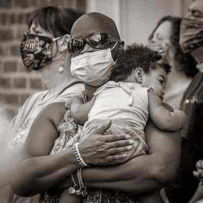 Woman wearing mask holding baby during Black Lives Matter rally (IMG3915014)