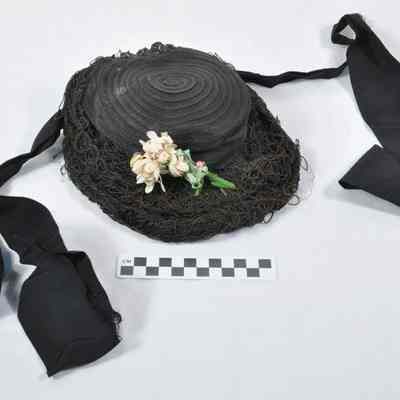 Nearly round, black child's bonnet