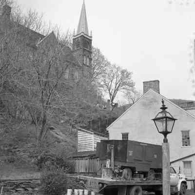 Drilling and pining rock behind Stage Coach Inn and near Catholic Church