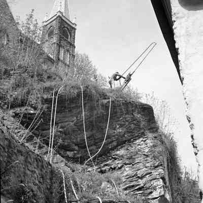 Drilling and pining rock behind Stage Coach Inn and near Catholic Church