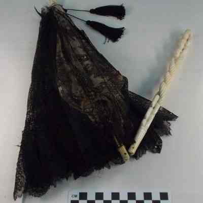 Black lace parasol with ivory handle and ivory finial