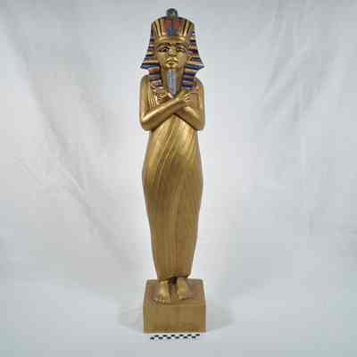 Painted wood carving of King Tutankhamun
