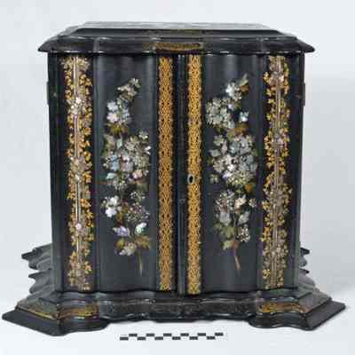 Multi-drawered,rectangular papier mache sewing cabinet