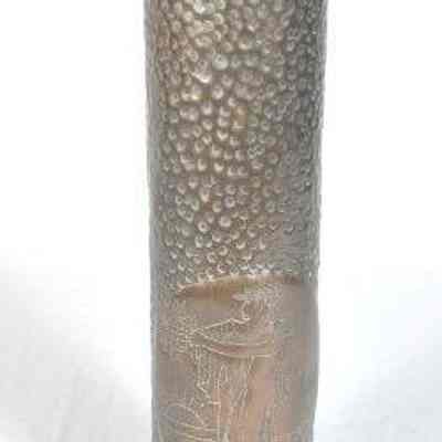 Shell casing with hammer and punch designs