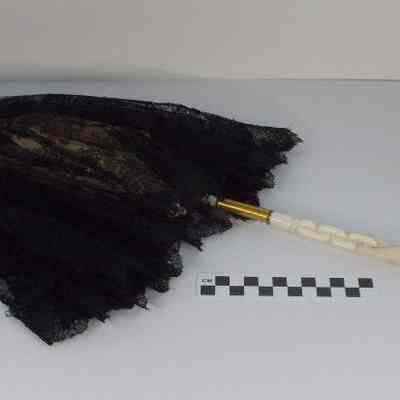 Black lace parasol with ivory handle and ivory finial