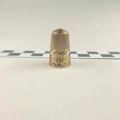Brass colored thimble
