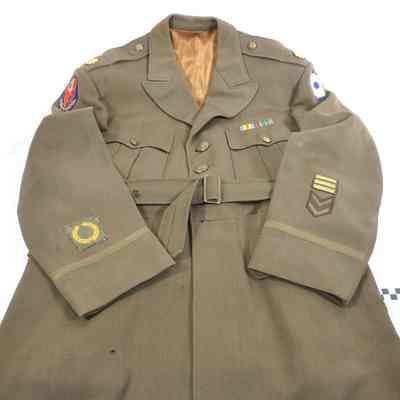 World War II olive drab officer's tunic with major's oak leaves on epaulets