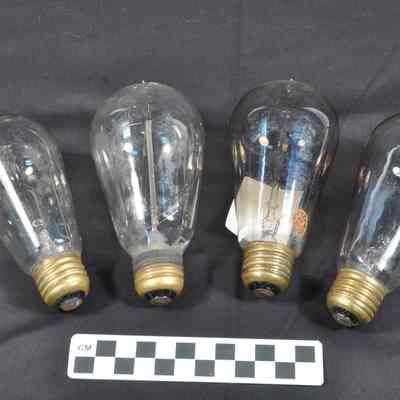 Four late 19th or early 20th century light bulbs