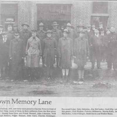 World War I veterans standing in front of Ennis' Barber Shop, 1918