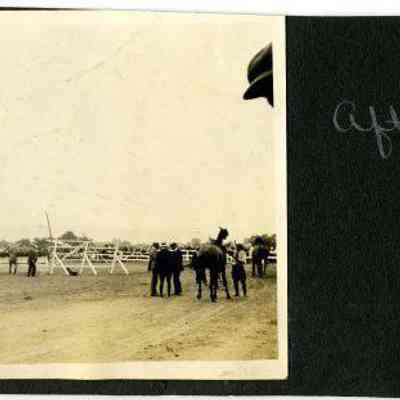 Horses and men on field, "After the race"