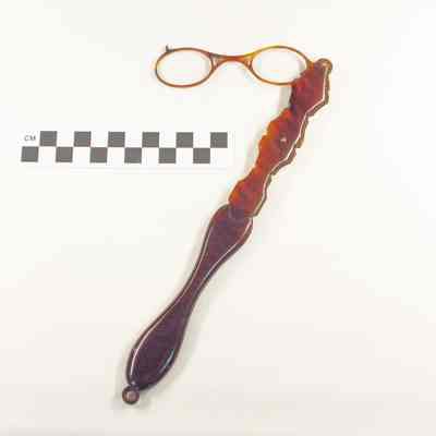 Tortoiseshell eyeglasses on long handle