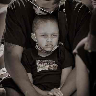 Man hugging child during Black Lives Matter rally (IMG3915025)