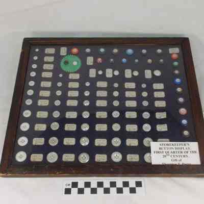 Storekeeper's button display in wood frame with glass frontv