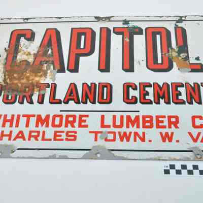 Red, black and white enameled sign