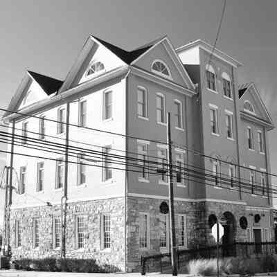 Apartment and Ranson City office building, former Charles Town Graded and H