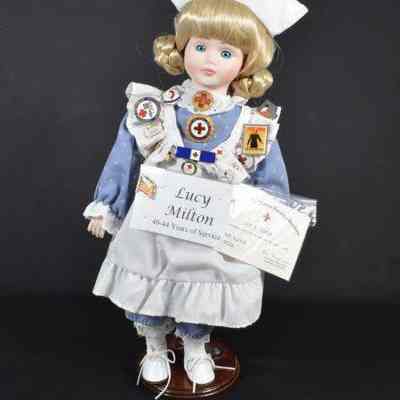 Plastic doll dressed in student nurse's uniform