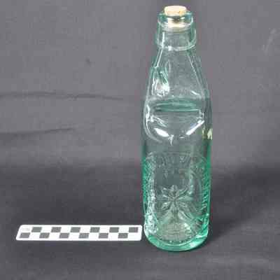 Light green glass beverage bottle
