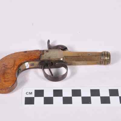 Pistol with brass barrel