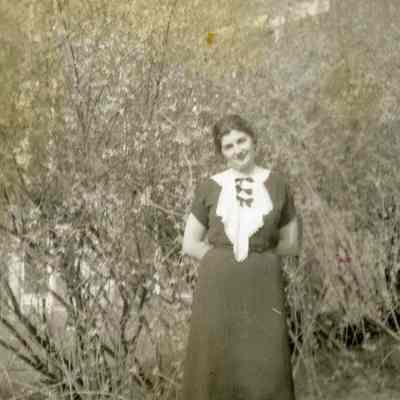 Miss Mary Madison Smootz by a house on Liberty Street