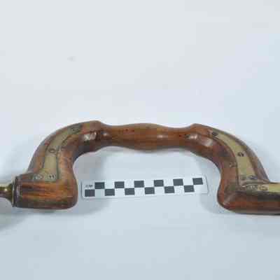 Wood and brass brace