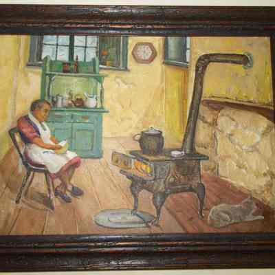 African American woman sitting by a stove: Origformat: Other