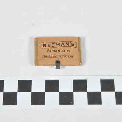 Small brown unopened paper package of gum