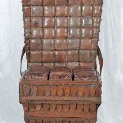 Chair made of leather, wood, canvas, nails, and horsehair