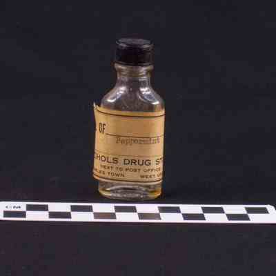 Clear glass pharmacy bottle with black plastic cap