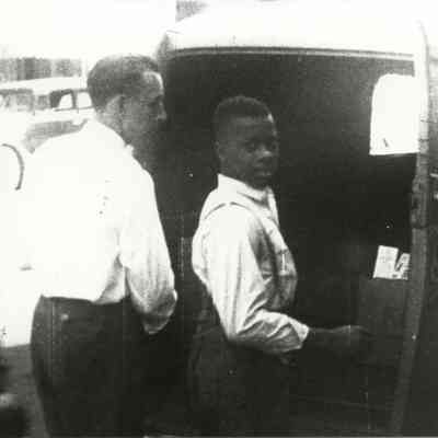 Young African American man loading a truck