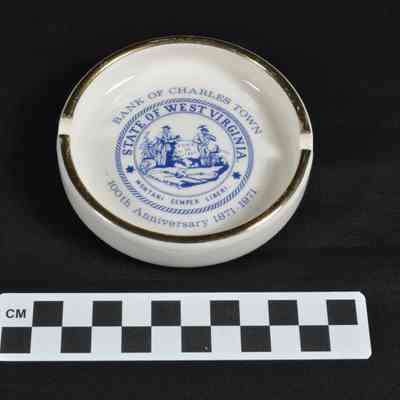 White ceramic ashtray with gilt rim