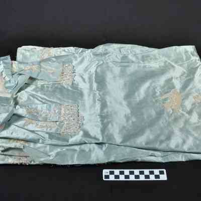 Light blue silk piece of material with beads sewn on in designs