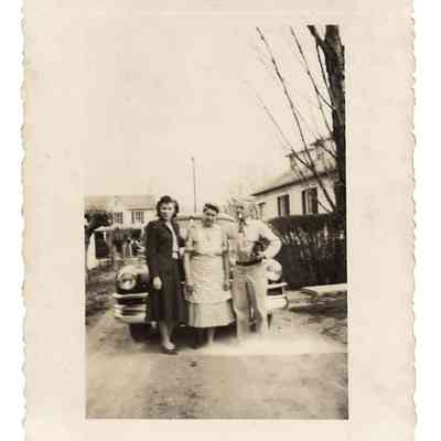 Dorothy Webb Welsh, Laura Ellen Lewis Welsh, Martin D. Welsh Sr. posing in front of car with houses in the background: IMG2025.026.001 (36)
